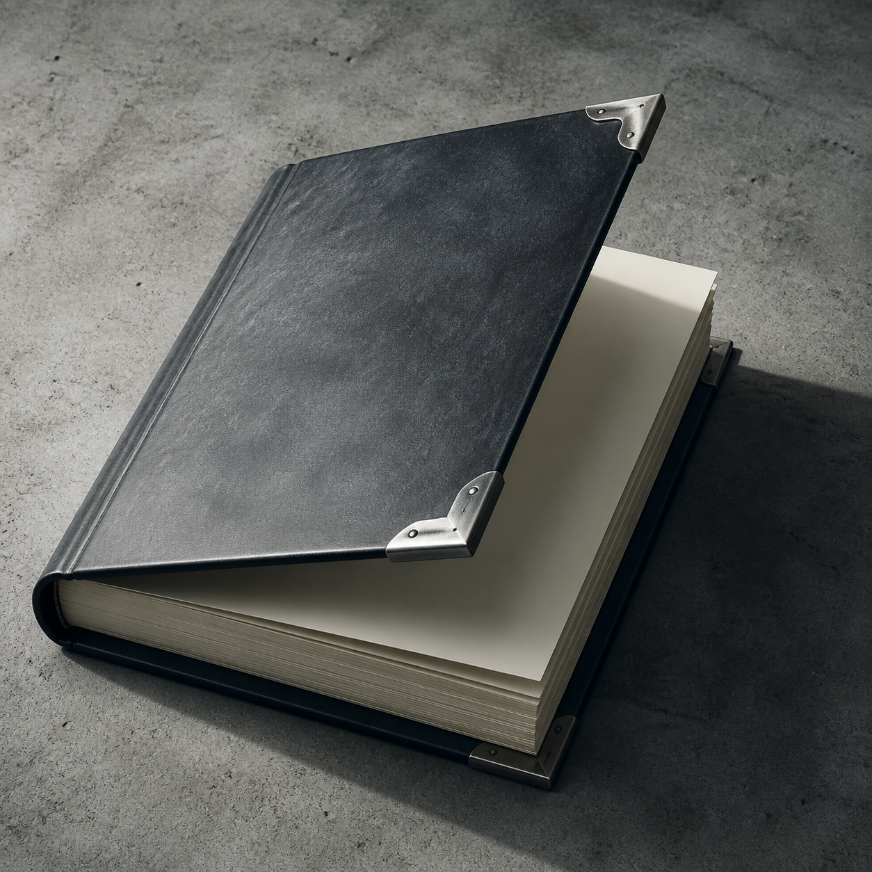 A heavy bound ledger book with steel corners on concrete.